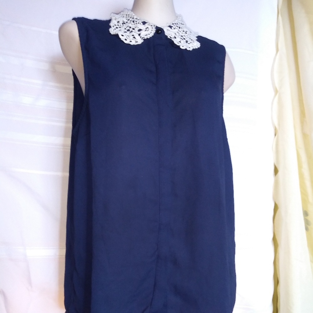 Women's navy blue top. White designed collar neck